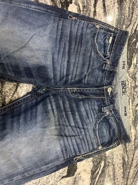 Rock Revival Men’s Distressed Medium Blue Straight Jeans